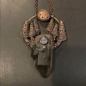 Long chained full moon scene with a large quartz.